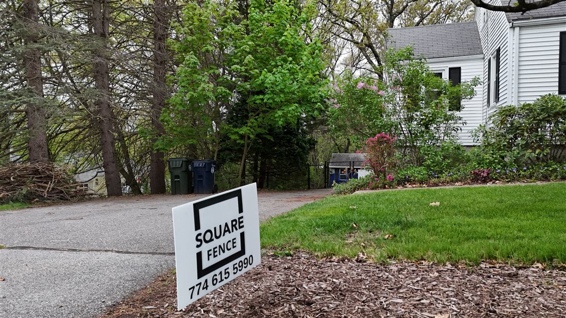 Chain link installation with Square Fence yard sign