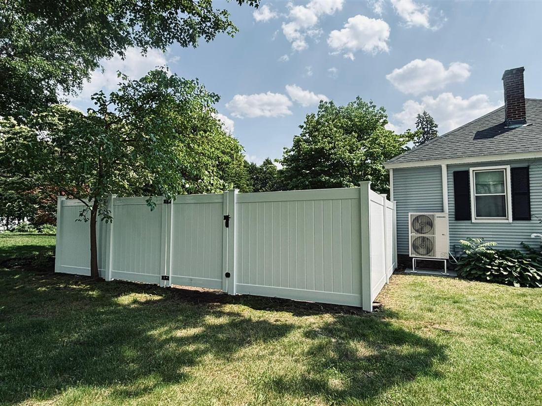 White vinyl privacy fence with matching gate