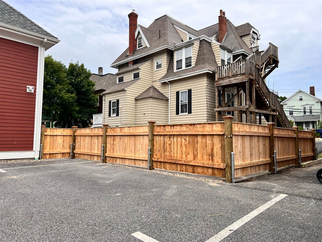 Cedar board fence around a commercial lot